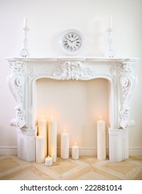 White Decorative Fireplace With Candles