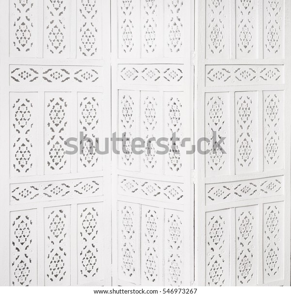 White delicate decorative wood\
panel. folding screen. Ornate carved folding screen.\
Boudoir