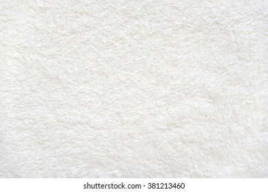 White delicate soft  background of plush fabric - Shutterstock ID 381213460