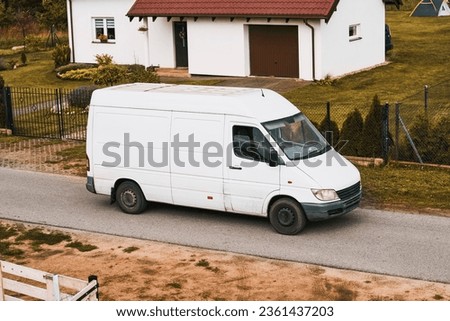 White delivery van. Modern delivery small shipment cargo courier van moving on a road. Delivery truck shipping parcels.