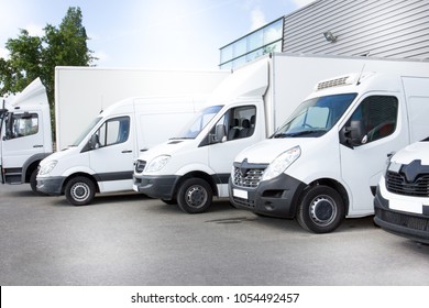 white delivery vans truck on parking in front on the entrance a warehouse at distribution van center