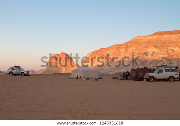 WHITE DESERT, EGYPT - OCTOBER 28, 2012:\
bivouac in the Egyptian White Desert at\
sunset.