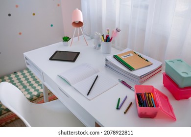 White Desk In Girl's Bedroom Decorated In Pastel Colors