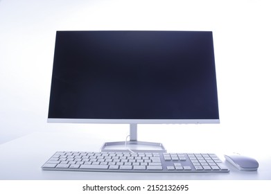 White desk placed desktop computer