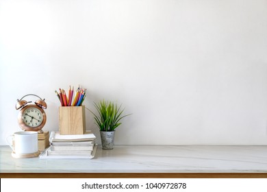 White Desk Table With Copy Space, Supplies And Coffee Mug. Front View Workspace And Copy Space