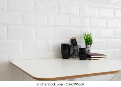 White Desk Table With Copy Space, Supplies And Coffee Mug. Front View Workspace And Copy Space