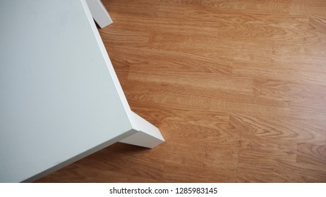 White Desk Top Angle View With Wood Background.