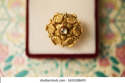 White Diamond Circled With Red And Gold Wedding Nose Pin