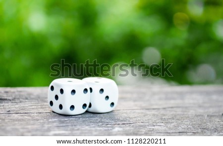 white dice on a green blurry background, playing dice macro photos Stock photo © 