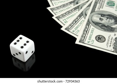 White Dice And US Money On Black Background. Gambling Concept.