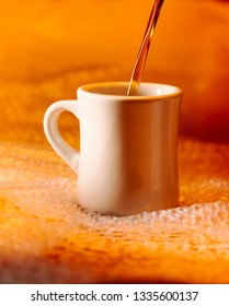 White Diner Coffee Cup With Coffee Pour On Golden Background