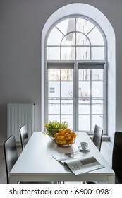 White Dining Room With Half Circle Window, Table And Chairs