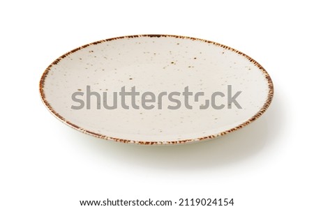White dinner plate isolated on a white background. Cutout of empty speckled plate with brown border. Modern porcelain crockery for food design. Tableware and dishes concept. Low angle view.
