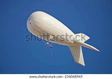 White dirigible in the cloudless sky