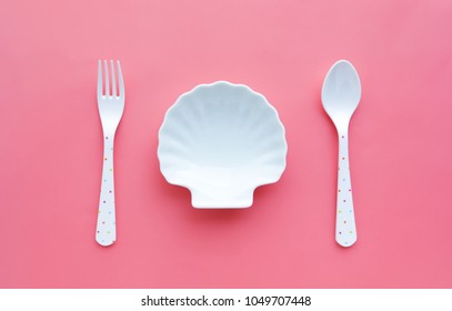 White Of Dish Shellfish And Spoon,fork On Color Background