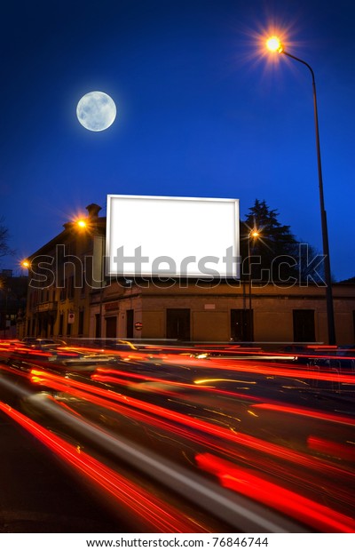 white display\
advertising with traffic at\
night