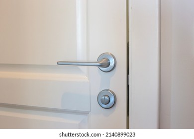 White Door And Silver Doorknob In The Apartment