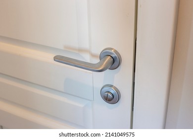 White door and silver doorknob in the apartment