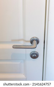 White Door And Silver Doorknob In The Apartment