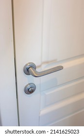 White Door And Silver Doorknob In The Apartment