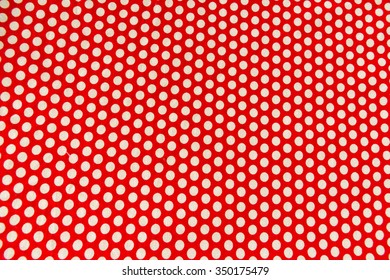 White dot pattern on red background

