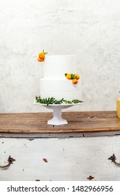 White Double Layer Cake With Tangerines