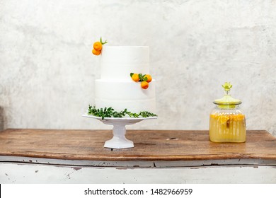 White Double Layer Cake With Tangerines