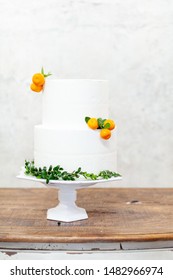 White Double Layer Cake With Tangerines