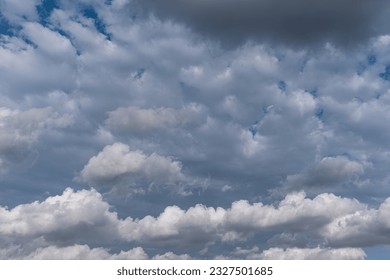 White and dramatic clouds in the blue sky.