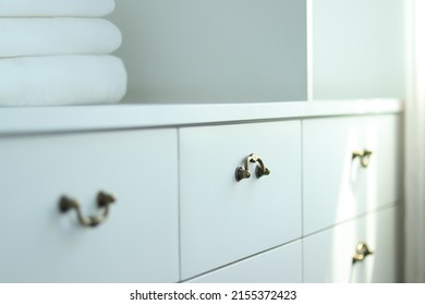 White Drawer With Vintage Hilt Or Grip. Tray And Aluminum Handle For Storing, Towels, Utensils, Wares. Close Up Shelf In Room, Walk In Closet. Minimal Built In For Studio, Office, Decoration, House.