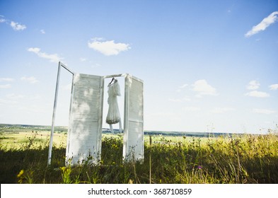 white dress on white folding screen. sunny summer day - Powered by Shutterstock