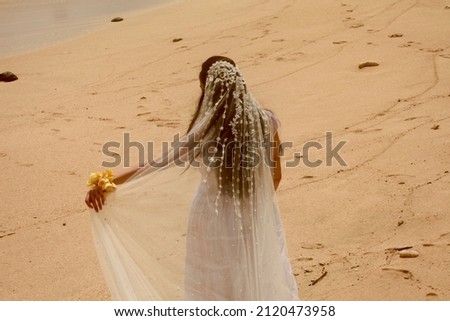 White dress women on the sands