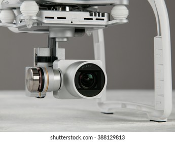 White drone. Quadrocopter with photo camera, close-up.