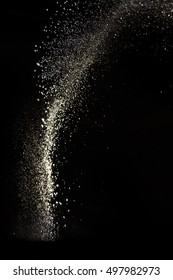 White Dust Debris Isolated On Black Background, Motion Powder Spray Burst In Dark Texture