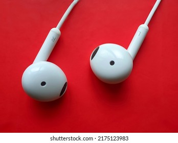 White Earphones Images In Red Background.cool Tech Background Wallpaper For Desktop Pc And Mobiles.R And L Marking On Headphones