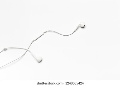 white Earphones isolated on white background - Shutterstock ID 1248585424