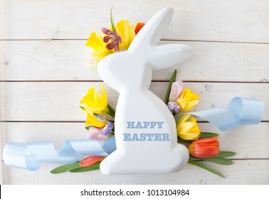 White easter bunny with fresh spring flowers