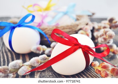 White easter eggs with color bow and willow - Powered by Shutterstock