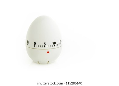 A White Egg Shaped Timer On A White Studio Background.