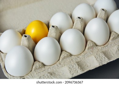 White Eggs In Egg Tray Carton With One Yellow Color Against Of Ordinary, Abstract Vision Be Different, Unique Personality Or Standing Out From The Crowd, Leadership Quality