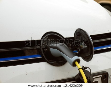 White electric car charging 