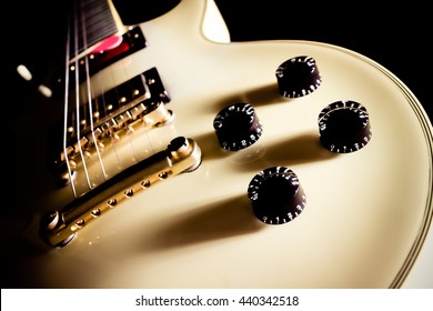 white electric guitar, isolated on black for music background 