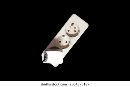 White electrical plug in wall socket. Electrical socket