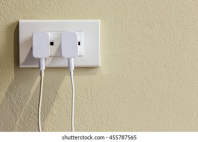 White Electrical Usb Cord And Charger Plug In Wall Outlet