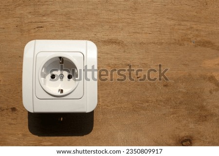 White Electrict socket on wood background