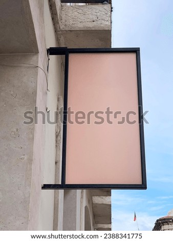 White empty blank rectangle boutique store restaurant cafe signboard box. Mock up of square signboard. Signboard or signage with blank sign mockup on a shop wall
