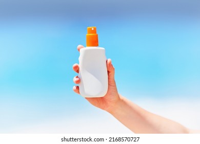 White Empty Bottle Blank Of Sunscreen Lotion Spray For Text Advertising In Hand