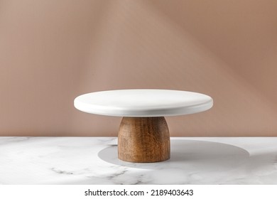 White empty Cake stand, Bakery utensil and dishware. Podium for cake. Minimalist mock up for cake with window shadow. Design Template. Front view.