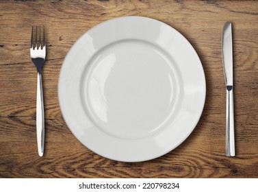 White Empty Dinner Plate Setting On Table