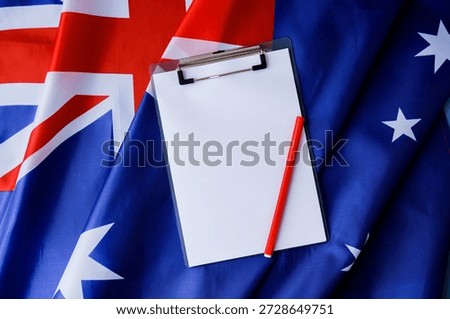 White empty paper copy space template mock up Australian flag background. National symbol and patriotism concept, ideal mock-up for custom copy designs. Place your logo or text on the white paper